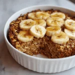 A delicious plate of High-Protein Banana Bread Baked Oatmeal - Hannah Magee RD