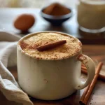 A close-up view of a delicious cinnamon mug cake topped with melting sugar.