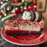 A close-up side view of a vibrant red velvet cheesecake adorned with Christmas sprinkles and mini Oreos.