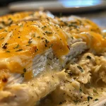 Juicy Crockpot Angel Chicken with melted cheese on top.