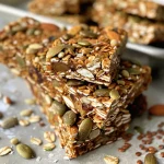 Close-up of homemade Superfood Granola Bars with visible nuts and seeds.