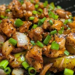 Close-up view of Black Pepper Chicken with vibrant colors and textures.