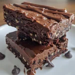 A close-up side view of a Brownie Protein Bar, highlighting its rich chocolate texture and mini chocolate chips.