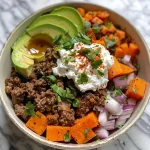 Close-up view of a Ground Beef Hot Honey Bowl with toppings.