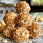 Close-up view of No-Bake Peanut Butter Energy Bites with oats.