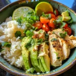 Creamy avocado chicken rice bowl showcasing vibrant ingredients.