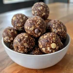 Close-up view of Date Energy Balls on a textured surface.