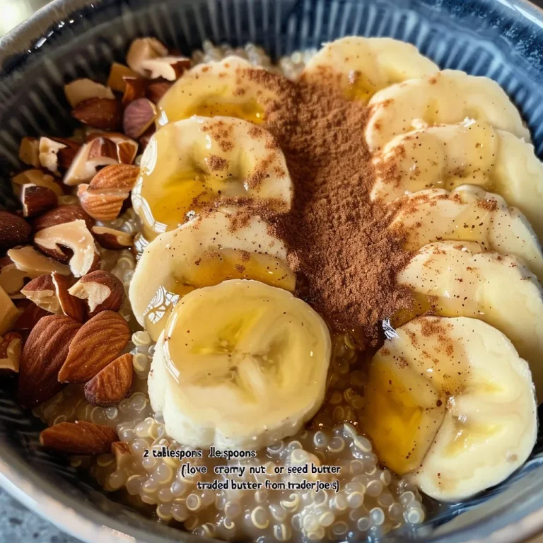 Close-up view of a vibrant vegan quinoa breakfast bowl with nut butter and fruit.