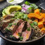 Close-up of a colorful Garlic Cilantro Steak Power Bowl with fresh ingredients.