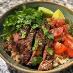 ['Close-up side view of a healthy steak bowl featuring juicy steak and vibrant vegetables.', 'An appetizing steak bowl highlighting tender slices of steak and fresh ingredients arranged beautifully.', 'Side perspective of a delicious steak bowl with juicy meat and colorful toppings.', 'A close-up of a steak bowl showcasing succulent steak and healthy toppings, captured with an iPhone.']