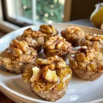['Close-up side view of golden brown Honey Nut Toasted Oat Breakfast Bites.', 'A delicious cluster of Honey Nut Toasted Oat Breakfast Bites with a crunchy texture.', 'Tasty breakfast bites made from oats, walnuts, and honey, displayed beautifully.', 'Side view of Honey Nut Toasted Oat Breakfast Bites showcasing their enticing color and ingredients.']