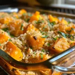 ['Close-up view of a Vegetarian Butternut Squash Quinoa Casserole with golden-brown top and visible ingredients.', 'Side view of a hearty Vegetarian Butternut Squash Quinoa Casserole in a baking dish, showcasing its layers.', 'Delicious Vegetarian Butternut Squash Quinoa Casserole with a glossy surface and diced vegetables peeking through.', 'Close-up shot of a warm, cooked Vegetarian Butternut Squash Quinoa Casserole highlighting its cheesy topping.']